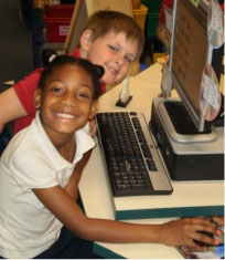 Photo of two students conducting internet projects